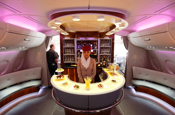 A picture shows the bar in the first class section on board an Airbus A380 passenger plane of Emirates Airline at the ILA International Air Show in Schoenefeld outside Berlin, June 8, 2010. Dubai's Emirates, the Arab world's largest airline, has placed an $11 billion order for 32 A380 jets from EADS's Airbus unit, the biggest ever for the company's superjumbo passenger plane.REUTERS/Thomas Peter  (GERMANY - Tags: TRANSPORT BUSINESS SOCIETY) - RTR2EWEH